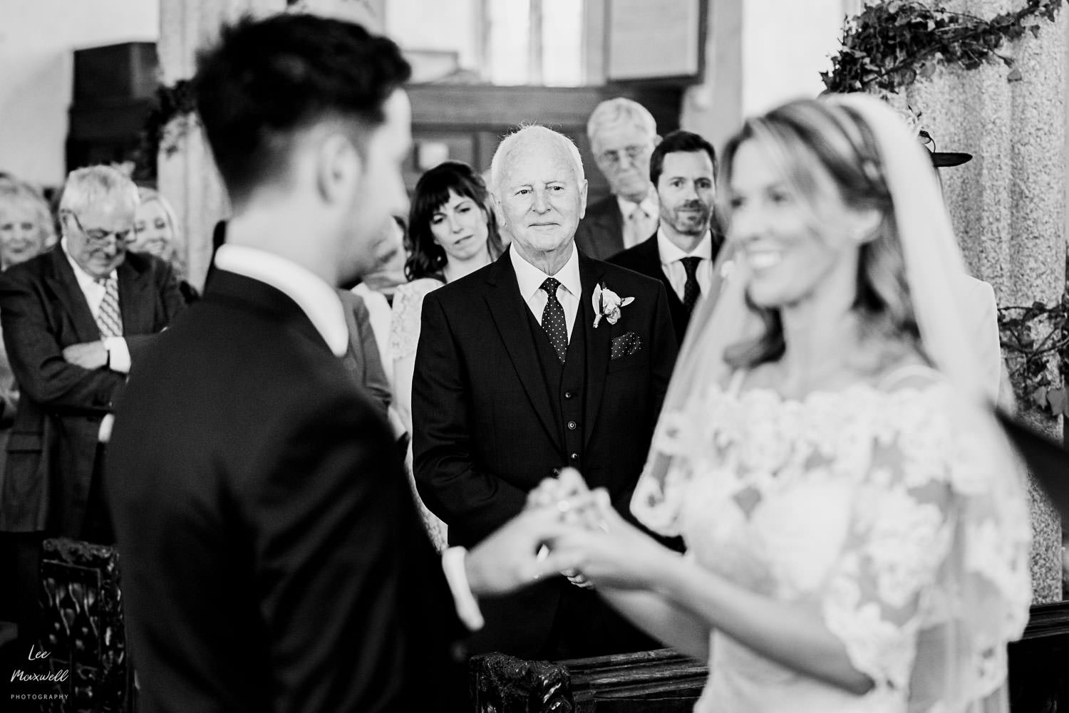 Proud dad looking at bride