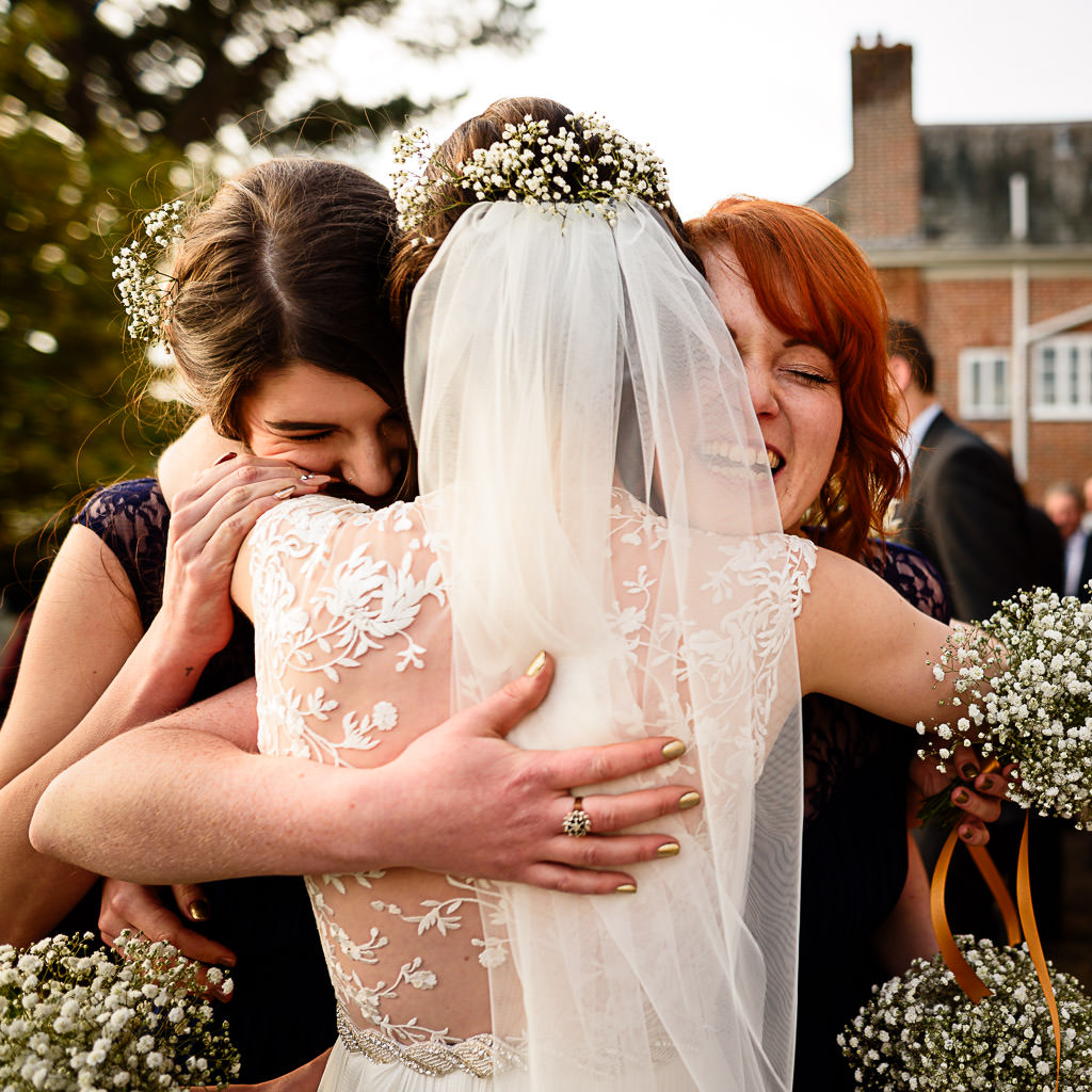 Big hug for bride at devon wedding