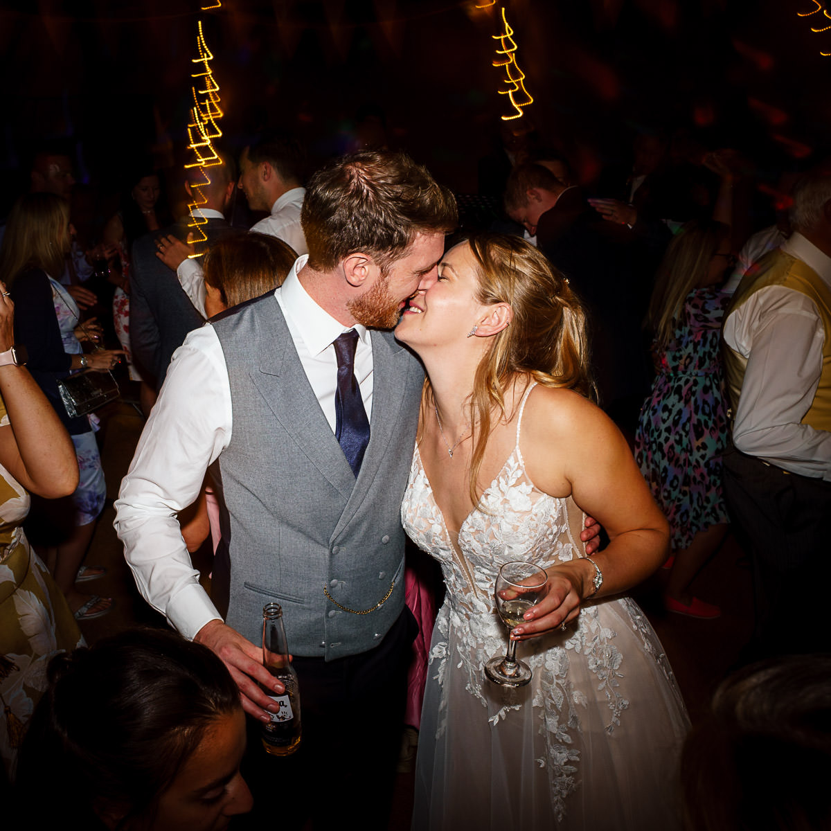 Fun bride and groom moment in cornish tipi wedding